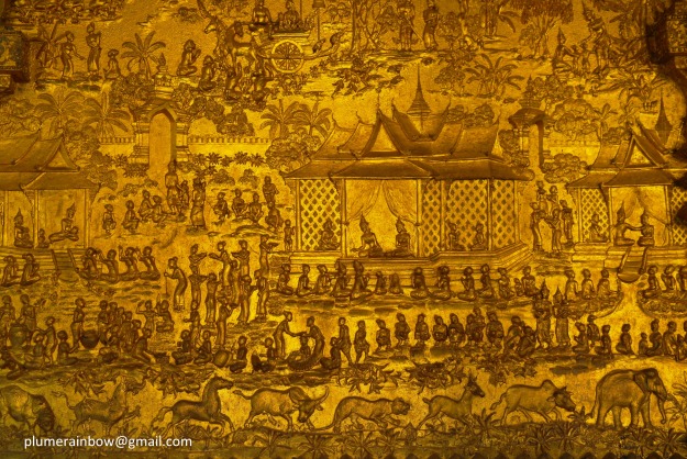 Art work on resplendent gold relief wall at Wat Mai, Luang Prabang